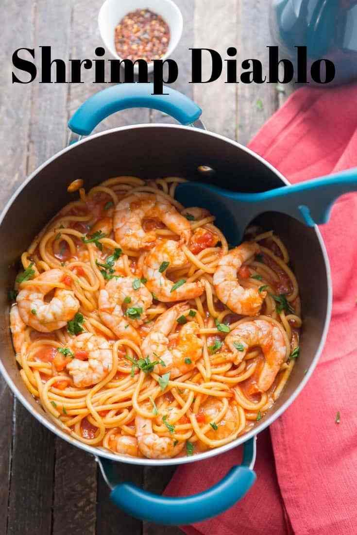 pasta with shrimp and tomato sauce in a pot