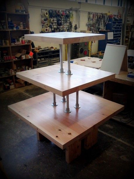 a workbench in a workshop with tools on the table