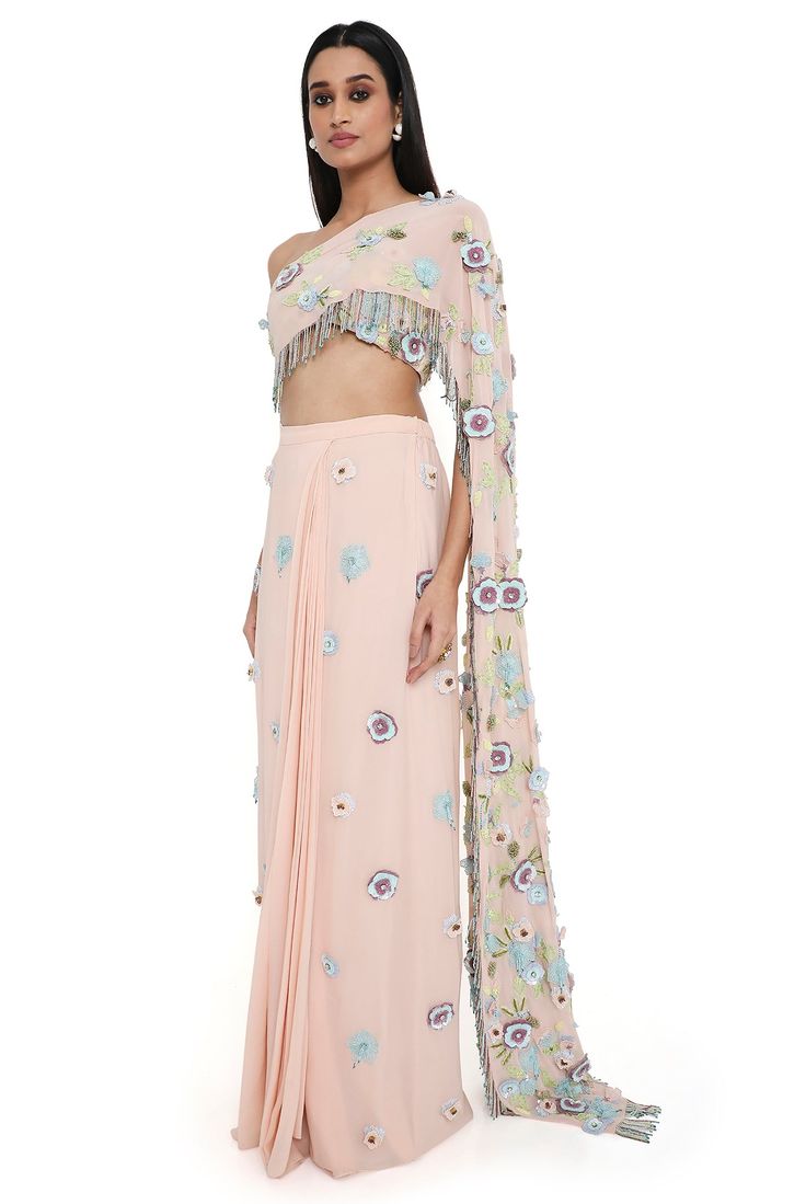 Blush pink georgette embroidered choli with attached pallu with hanging colorful tassels and embroidered pre-stitched skirt. Disclaimer: Since we are a made-to-measure brand and our dyeing process and embroidery are handcrafted, there may be slight variations in the color and embroidery of the actual product. The print placement may also vary from what is represented in the images shown on the product page. Colorful Tassels, Nehru Jackets, Western Wedding, Wedding Service, Dyeing Process, Print Placement, Short Suit, Bride Bridal, Embroidered Top