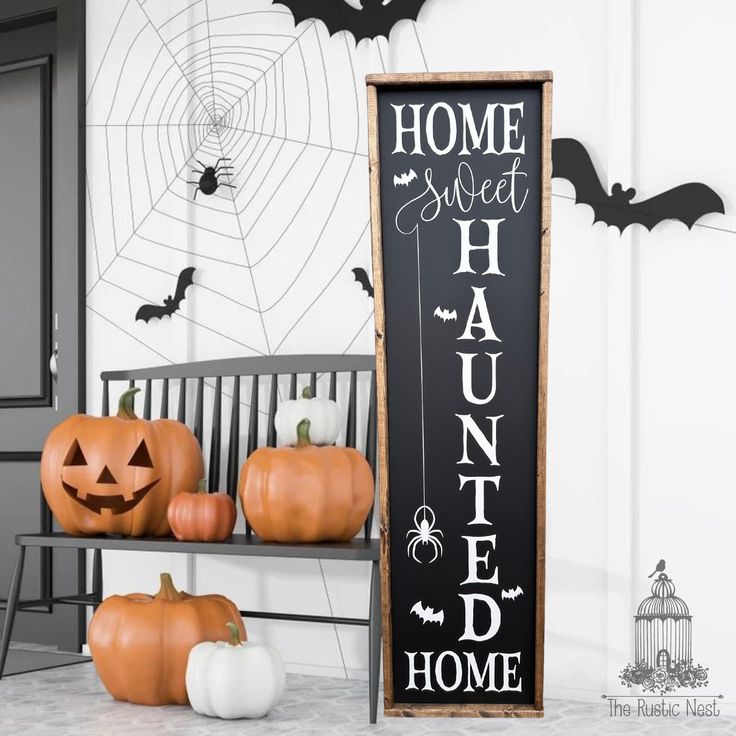 two pumpkins sitting on a bench in front of a sign that says home sweet halloween