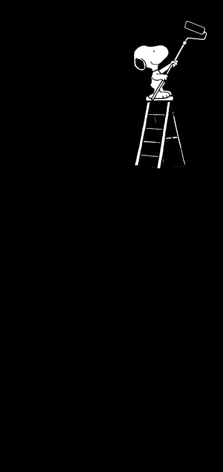 a black and white photo of a ladder with a lamp on it in the dark