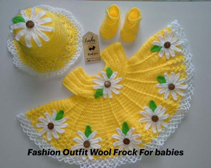 a crochet baby outfit and booties are on display