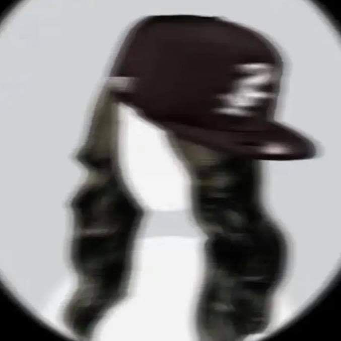 a person wearing a hat in front of a white circle with black and grey stripes