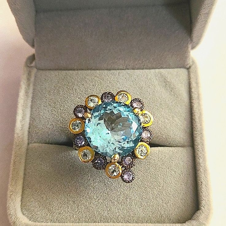 Absolutely Stunning Work Of Art For Your Hand. 19ct African Blue Topaz, 15mm. Sterling Silver With Black Rhodium & Gold Plating. Stamped 925. Small Tanzanite Stones Around. Weight 11g. Center Stone Has No Flaws Visible With 10x Loupe. Sz 8.5 But Can Be Resized At Jeweler. Blue Topaz Is Associated With Wisdom, Communication & Finding The Pathways To Success. It's A Stone That Alleviates Fear And Worries And Invites You To Embrace Your Noble Self & Trust Your Power. It Is The Stone Of Clarity. Off Self Trust, Topaz Cocktail Ring, Boho Rings Gold, Lemon Quartz Ring, Sea Opal, Blue Bubbles, Pave Wedding Rings, Pink Dragon, Silver Rings Simple