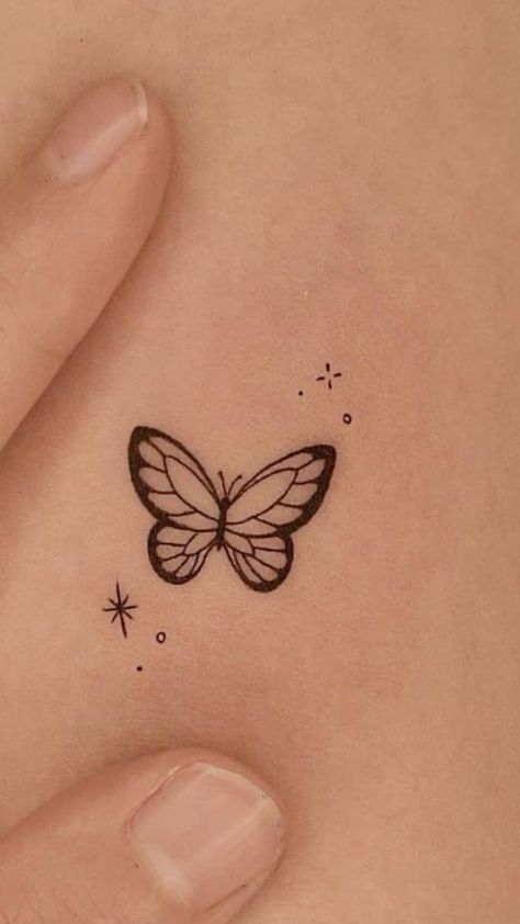 a small butterfly tattoo on the stomach