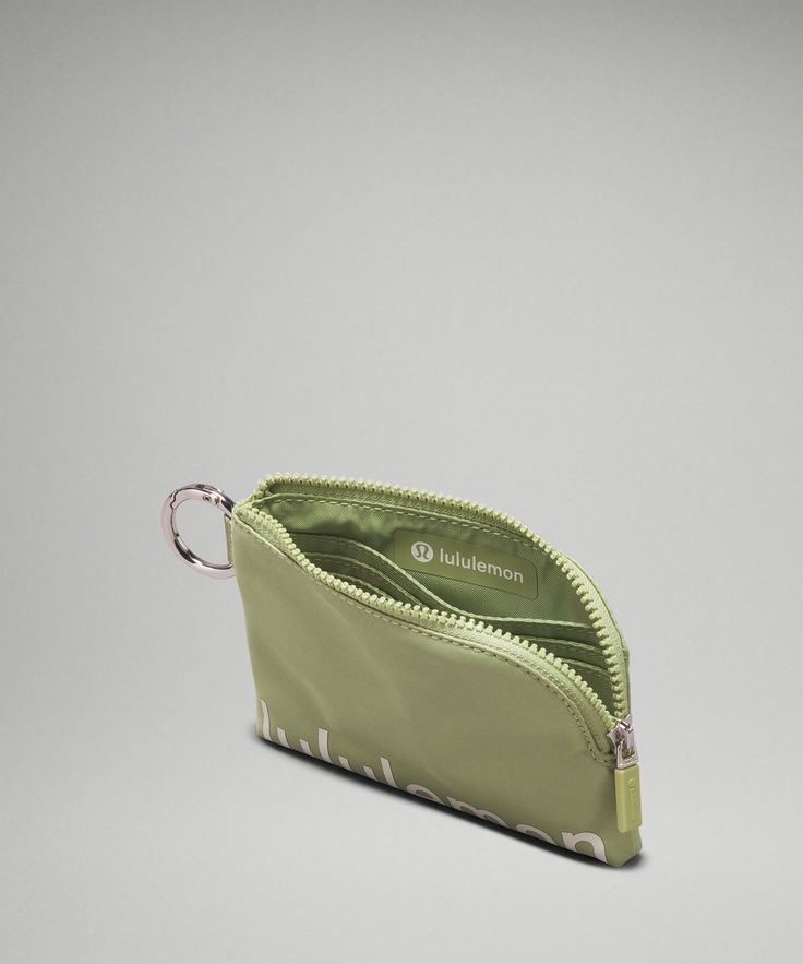 Zip, clip, and go. Secure this pouch onto your keychain, belt loop, or bag to keep your cards and cash handy. Designed for On the Move. Dimensions: 12cm x 8.5cm (4.7" x 3.3"). Easy-access exterior cardholder. Zippered main compartment. Interior slots to organize your cards. Lululemon Pouch Wallets For Everyday Use, Lululemon Pouch Wallet For Everyday Use, Lululemon Everyday Pouch Wallet, Lululemon Wallet With Cell Phone Pocket For On-the-go, Lululemon Rectangular Wallet With Zipper Closure, Lululemon Zipper Pouch Wallet For On-the-go, Lululemon Rectangular Wallets For Everyday Use, Lululemon Travel Wallet Rectangular, Lululemon Travel Wallet, Rectangular