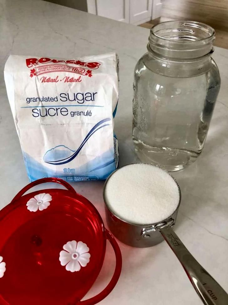 ingredients needed to make homemade sugar scrub sitting on a counter