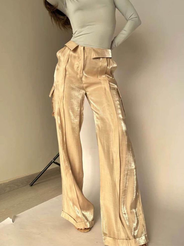 Introducing our Golden Years Glitter Fabric Drawstring Waist Pocketed Wide-Leg Pants – a glamorous addition to your wardrobe. Here's a description that captures their charm:Glittering Elegance: The glitter fabric adds a touch of sparkle and sophistication to your outfit. Whether it's a cocktail party or a fancy dinner. these pants will ensure you stand out.Comfortable Fit: The wide-leg design offers a comfortable and relaxed fit. allowing for freedom of movement. You can dance the night away or Hak Tinggi, Jeans Overall, Streetwear Pants, Jeans Cargo, Golden Years, Long Trousers, Fancy Dinner, Maxi Robes, Fashion Night