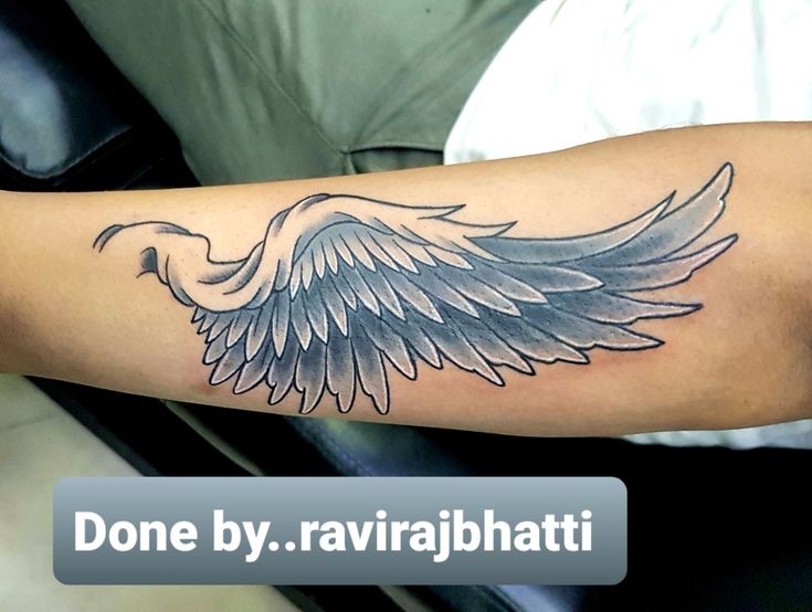 a tattoo with an eagle on the arm