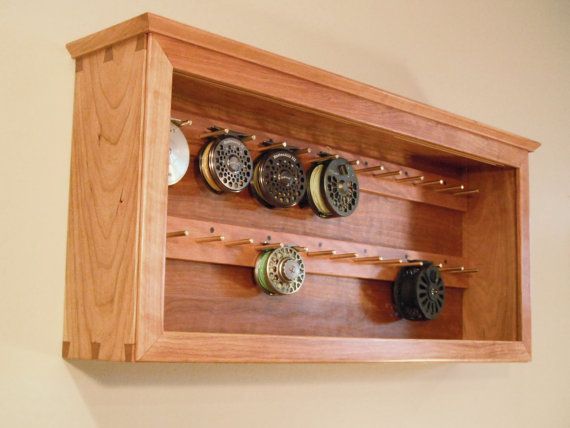 a wooden shelf with several different types of knobs on the top and bottom shelves