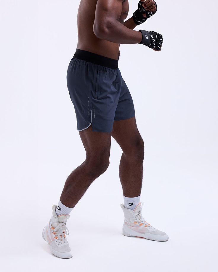 Developed alongside Bivol to keep you explosive and agile through intense training. Featuring split hems with reflective detailing for zero restriction when you need it most. Crafted from a SMRT-TEC fabric that wicks away moisture, ensuring you stay cool and dry, with zip pockets to secure all your training essentials. Finished with the subtle 'Mission: Seek & Destroy' statement running silently down your leg, a nod to Bivol’s quiet focus and inner drive. Bivol x BOXRAW branding Adjustable elast Dmitry Bivol, Lifestyle Club, Sauna Suit, Boxing Shorts, Heavy Bags, Split Hem, Sport Shorts, Wicks, Stay Cool