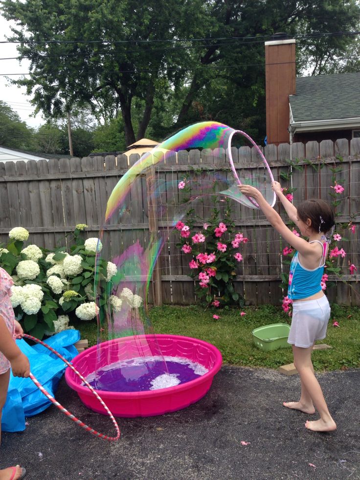 Wet and wild party giant bubble fun!  This solution is 10 gallons of distilled water, 10 cups of original Dawn and 30 drops of glycerine (Amazon).  The photo says it all! Water Birthday Parties, Giant Bubble Wands, Water Birthday, Splash Party, Bubble Birthday, Giant Bubbles, Bubble Fun, Summer Bash, Bubble Party