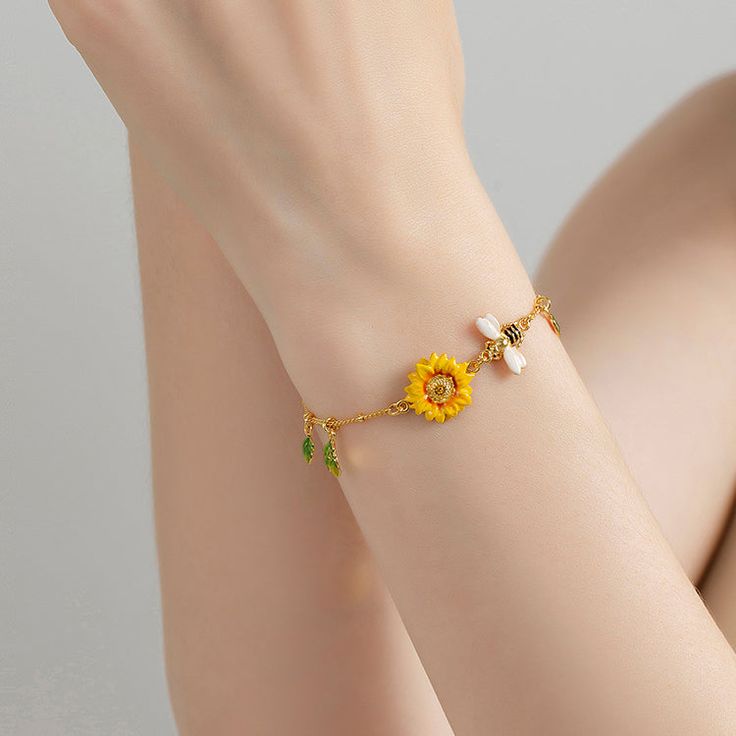 The bee symbolizes community, brightness, and personal power. Follow the bee to discover your new destination. Bee Gifts for bee lovers. Bee bracelets, high polished make bee & sunflower bracelet is very shining, very dainty, and pretty and simple but elegant. Detail Plating: 18K Gold Materials: 18K Gold on Brass, Enamel Size: Length: 6.30"(16cm)+Extender: 2.36"(6cm) Weight: 4.3g Hypoallergenic design Dainty Yellow Bracelet For Gift, Dainty Yellow Bracelet As Gift, Dainty Yellow Bracelet, Yellow Bracelet Jewelry For Gift, Handmade Yellow Charm Bracelet As Gift, Handmade Yellow Charm Bracelet Gift, Handmade Yellow Charm Bracelet For Gift, Yellow Bracelets With Flower Charm For Gift, Bee Sunflower