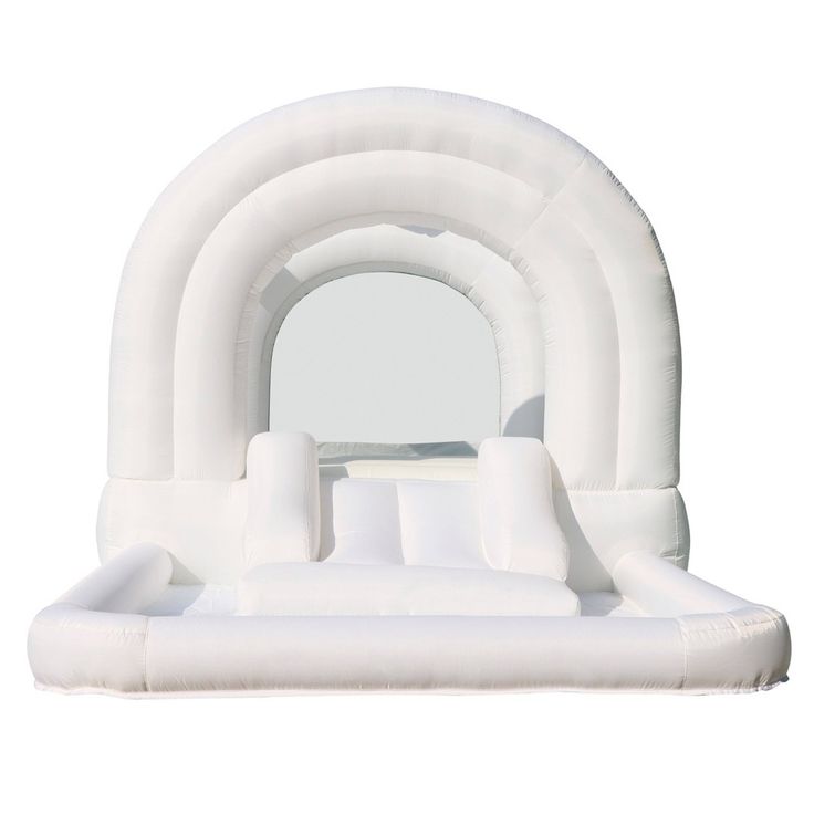 an inflatable arch with pillows on the bottom and white walls, is shown against a white background