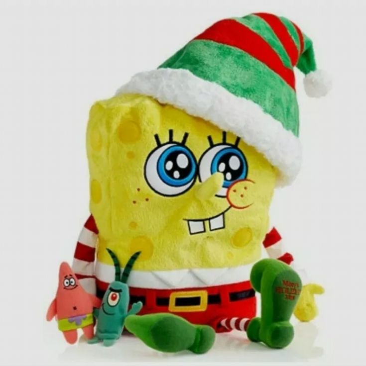 the spongebob plush toy is wearing a santa hat