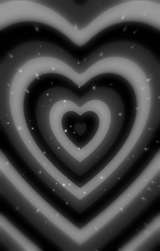 black and white photograph of a heart in the middle of an image with stars around it