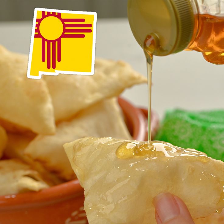 someone is pouring honey onto some food in a bowl