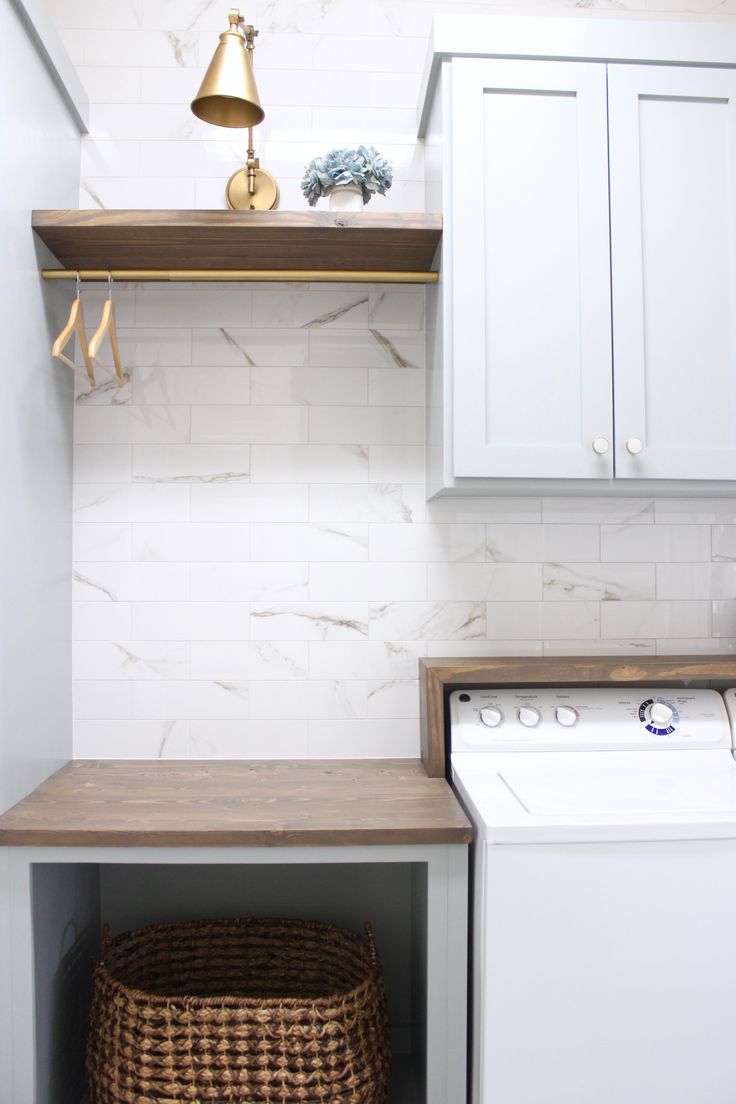 a white washer and dryer in a small room