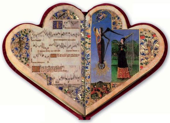 an open heart shaped book with pictures on it