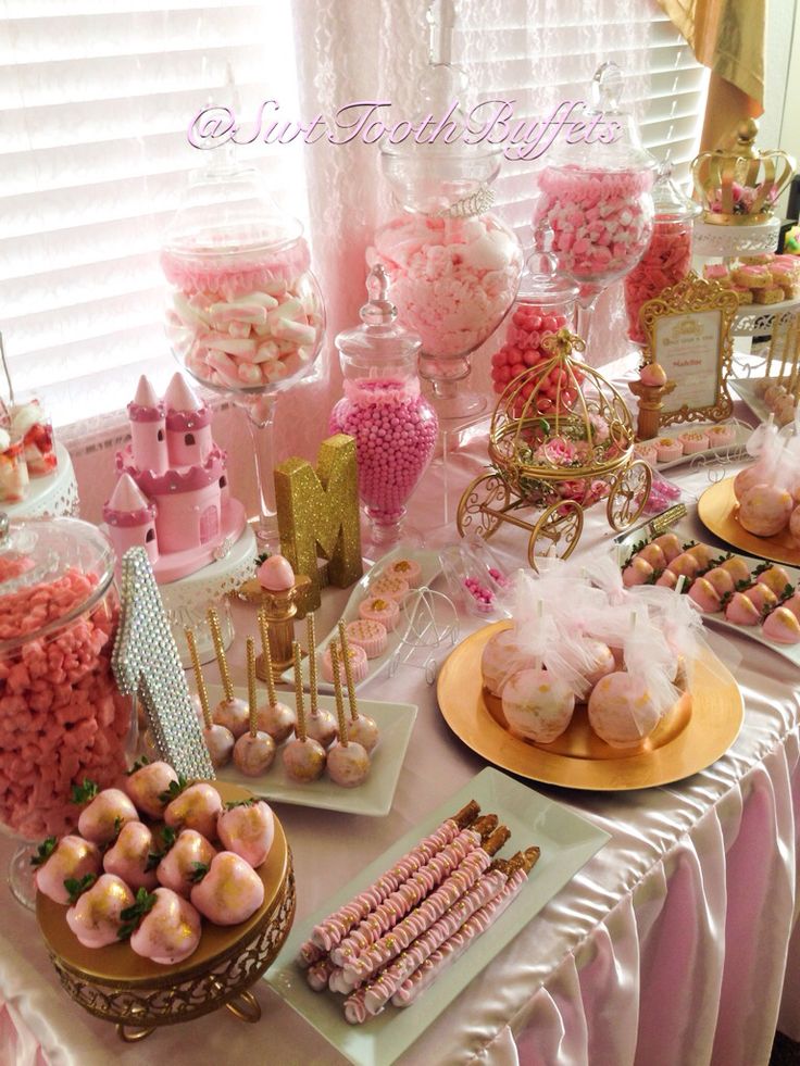 a table topped with lots of desserts and candy