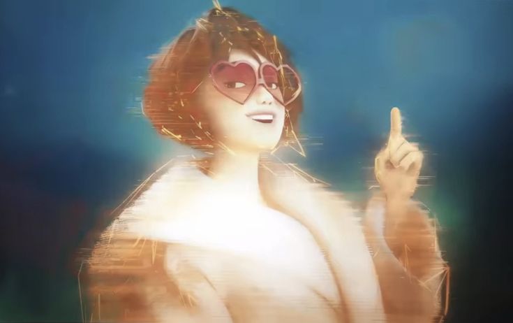 a woman with sunglasses pointing to something in her hand