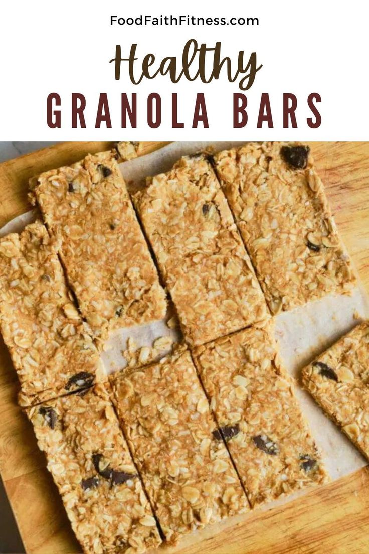 granola bars cut into squares on top of a cutting board with text overlay