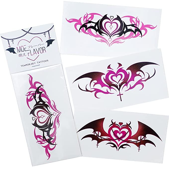 three temporary tattoos on white paper with pink and black designs in the shape of hearts