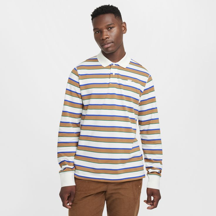 This polo is made with ultrasoft cotton fabric with vibrant contrasting stripes. Designed to feel relaxed through the body and sleeves for an athletic fit you can layer. Spring Cotton Polo Shirt With Contrast Stripes, Casual Striped Long Sleeve Polo Shirt, Casual Long Sleeve Striped Polo Shirt, Casual Striped Polo Shirt, Sporty Striped Polo Shirt With Ribbed Collar, Casual Cotton Polo Shirt With Striped Cuffs, Sporty Striped Cotton Polo Shirt, Casual Nike Cotton Polo Shirt, Athletic Fits