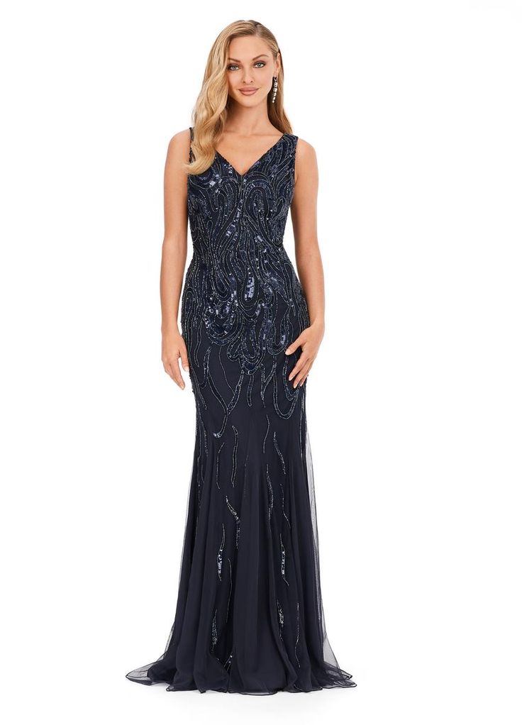 This classic fitted gown features a v-neckline, v-back and a flattering bead pattern. Elegant Embellished V-neck Evening Dress, Elegant V-neck Dress With Beaded Straps, Elegant Evening Dress With Beaded Straps And Fitted Bodice, Elegant Floor-length Evening Dress With Beaded Straps, Fitted V-neck Evening Dress With Beaded Straps, Elegant Beaded Straps Floor-length Evening Dress, Gala V-neck Gown With Fitted Bodice, Elegant Gown With Beaded Straps For Prom Season, Fitted Bodice V-neck Gown For Gala