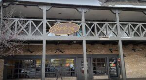 an old building with a sign on the front and side of it that says,