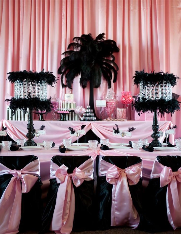 pink and black dessert table with palm tree