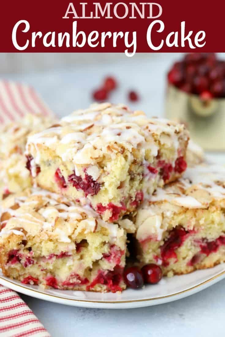 cranberry cake with white icing on a plate