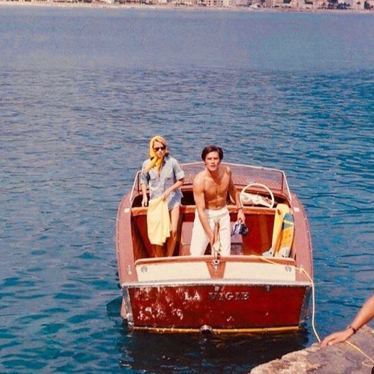 two people on a boat in the water