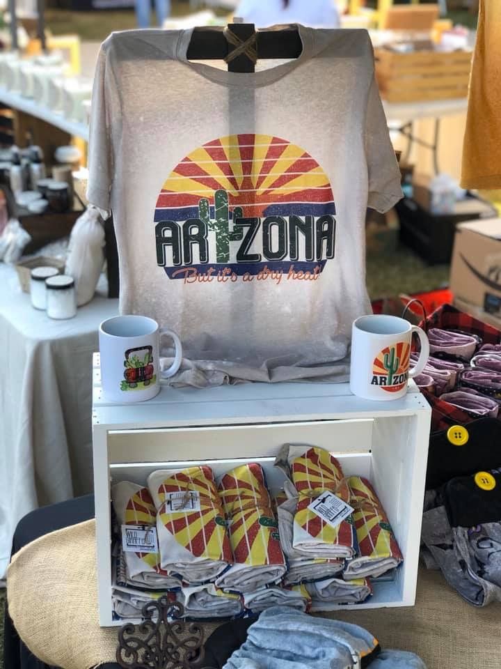 an arizona t - shirt is on display with other items for sale at the flea market