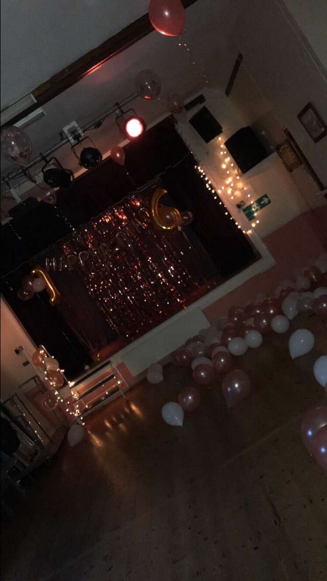 an overhead view of a room with balloons and lights