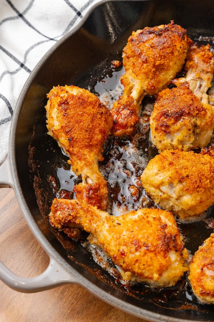 some chicken is cooking in a skillet