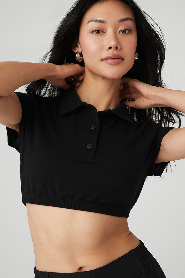 Give off the ultimate prep school chic vibes in the Cropped Prestige Polo. Its super-cropped, fitted silhouette will get you cool points at yoga class and with all your friends when you sport it for your next outing. Pair it with any high-waist bottom in your collection. Super-cropped, fitted silhouette Button-up with cool collar Designed & uniquely fit to flatter every size Wear-tested by our in-house team for the perfect fit Casual Alo Yoga Tops For Loungewear, Alo Yoga Casual Loungewear Top, Alo Yoga Stretch Tops For Loungewear, Black Athleisure Cropped T-shirt For Workout, Alo Yoga Black Top For Loungewear, Alo Yoga Stretch Athleisure Crop Top, Solid Cropped T-shirt For Athleisure, Solid Athleisure Cropped T-shirt, Trendy Fitted Cropped T-shirt For Workout