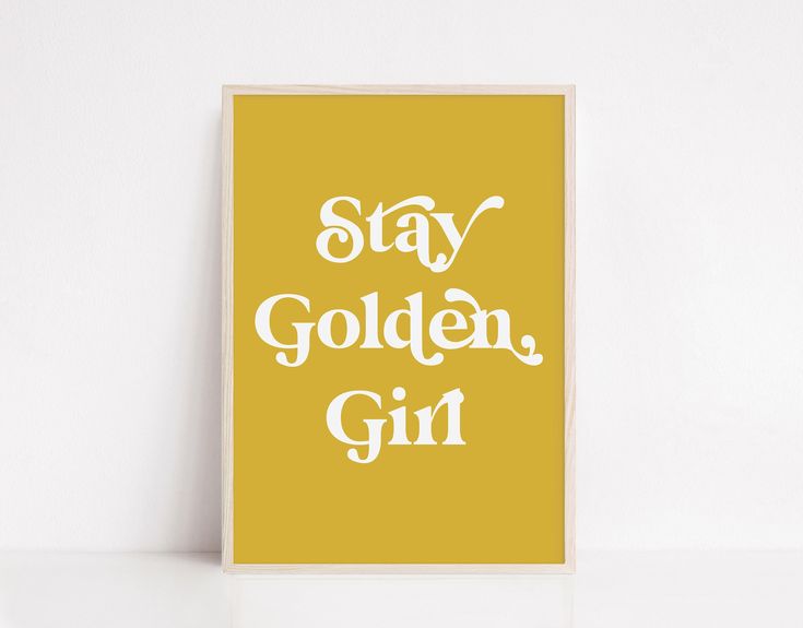 a yellow poster with the words stay golden, girl on it in white letters against a pale background