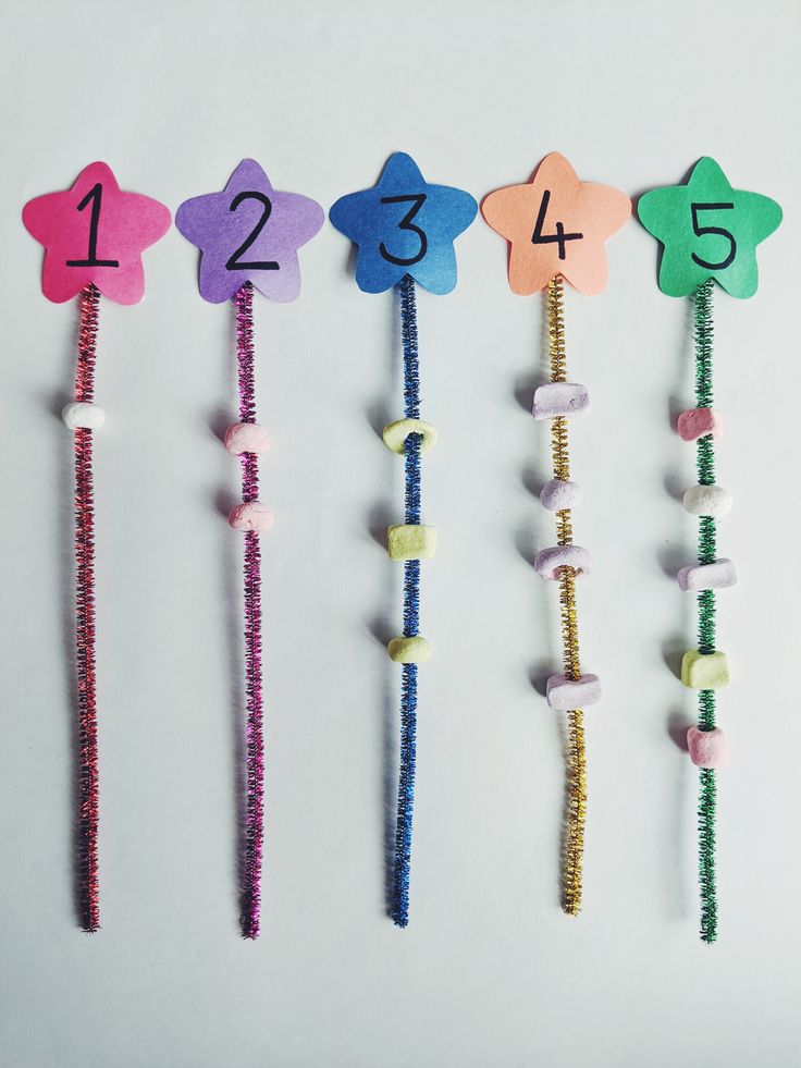 the numbers are lined up in different colors and shapes, along with candy wands