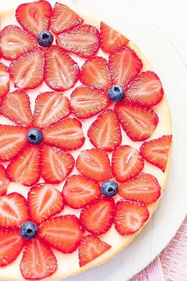 a pizza with strawberries and blueberries on it