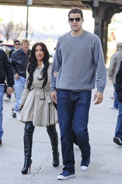 a man and woman walking down the street