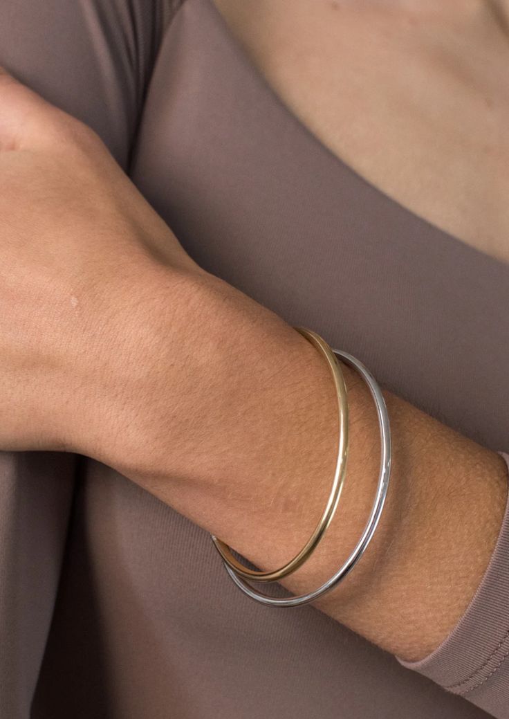 This is what lightweight stacking dreams are made of with Jenny Birds water-durable and lightweight designed Dane Bangle Set. Details: gold ion-plated steel rhodium ion-plated steel finish: high polish tension closure Measurements: Dane Bangle Set - 6" (2-pk) circumference: 6 1/2" inner diameter 57 x 47mm / 2.24 x 1.86" cuff thickness 3mm / 0.12" height: 3mm / 0.12" weight: 4.1g About Jenny BirdFounded in 2008, Jenny Bird jewelry brand is celebrated for its modern, quality craftsmanship and bold Everyday Metal Cuff Bracelet With Polished Finish, Everyday Polished Metal Cuff Bracelet, Adjustable Modern Bangle Tarnish Resistant, Adjustable Tarnish-resistant Modern Bangle, Classic Everyday Metal Bangle, Modern Adjustable Tarnish Resistant Bangle, Modern Adjustable Tarnish-resistant Bangle, Modern Everyday Bangle With Bracelet Strap, Adjustable Minimalist Jewelry With Shiny Finish