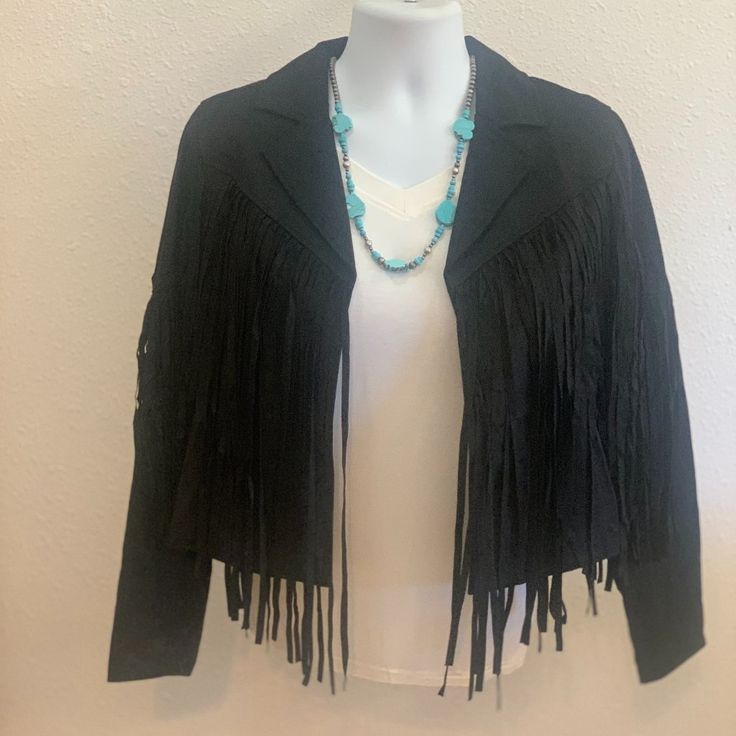 Wow!!!!!!! This Faux Suede Jacket Is So Cute, Classy And Chic! Suede Bodice With Long Sleeves Features Open Front Closure With Fringe Detail. This Jacket Is So Versatile And Can Be Dressed Up With A Skirt And Booties For A Night Out Of Dancing Or Dressed Down With Jeans And Boots And Sitting By The Fire With Friends. Black Fringe Long Sleeve Outerwear, Black Fringe Outerwear For Fall, Chic Black Outerwear With Fringe, Black Fringe Outerwear, Black Fringed Outerwear For Winter, Chic Leather Jacket With Fringe And Long Sleeves, Black Fringe Outerwear For Winter, Chic Long Sleeve Leather Jacket With Fringe, Chic Long-sleeve Leather Jacket With Fringe