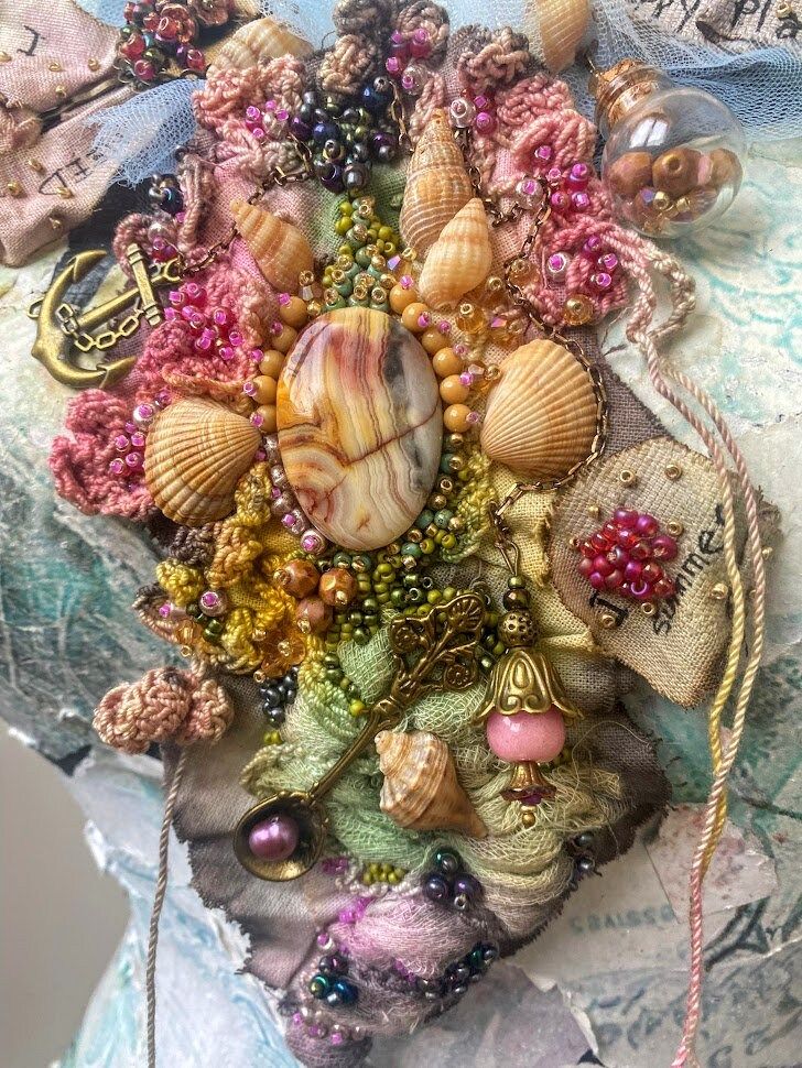 a close up of a bunch of different things on a table with beads and other items