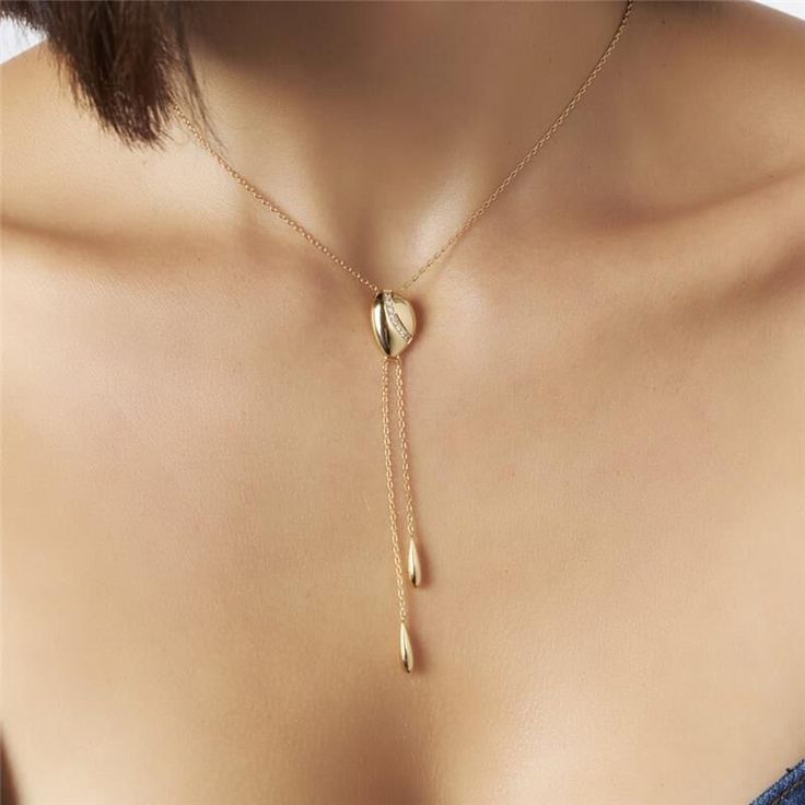 Introducing our 18K Gold-Plated Tie Necklace with Zirconias — a statement of refined elegance and timeless glamour. Versatile and chic, this piece effortlessly elevates any ensemble, making it the perfect accessory for both casual and formal occasions. 15.75in + 2in extender 40CM + 5CM Luxury White Lariat Necklace For Gift, Chic Clavicle Chain Necklace For Weddings, Chic Wedding Clavicle Chain Necklace, Gold-tone Clavicle Chain Jewelry For Wedding, Elegant Gold-tone Dangle Necklaces, Elegant Teardrop Plated Jewelry, Chic Formal Necklaces With Adjustable Chain, Chic Formal Necklace With Adjustable Chain, Elegant Teardrop Necklace For Formal Occasions