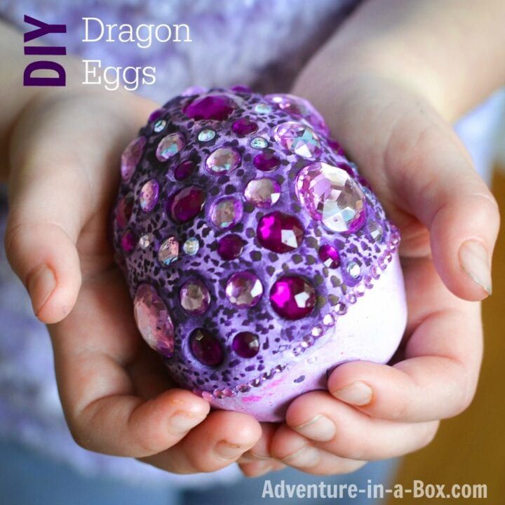 a person holding an egg in their hands with the words diy dragon eggs above it