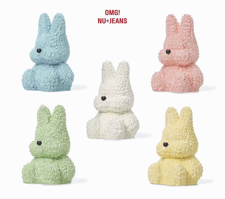 four different colored stuffed animals sitting next to each other in the same color and shape