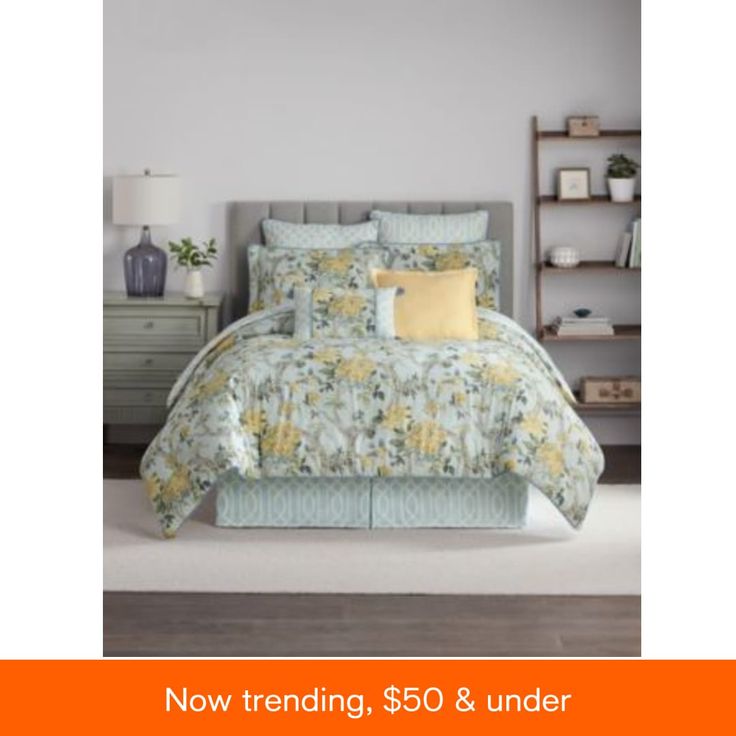 a bed with yellow and blue flowers on it