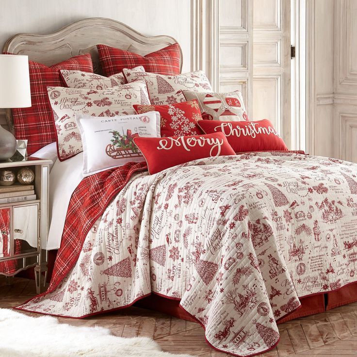 a christmas themed bed with red and white comforters