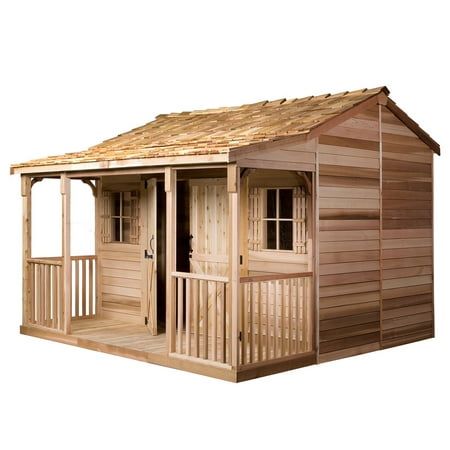 a wooden shed with a porch on the side